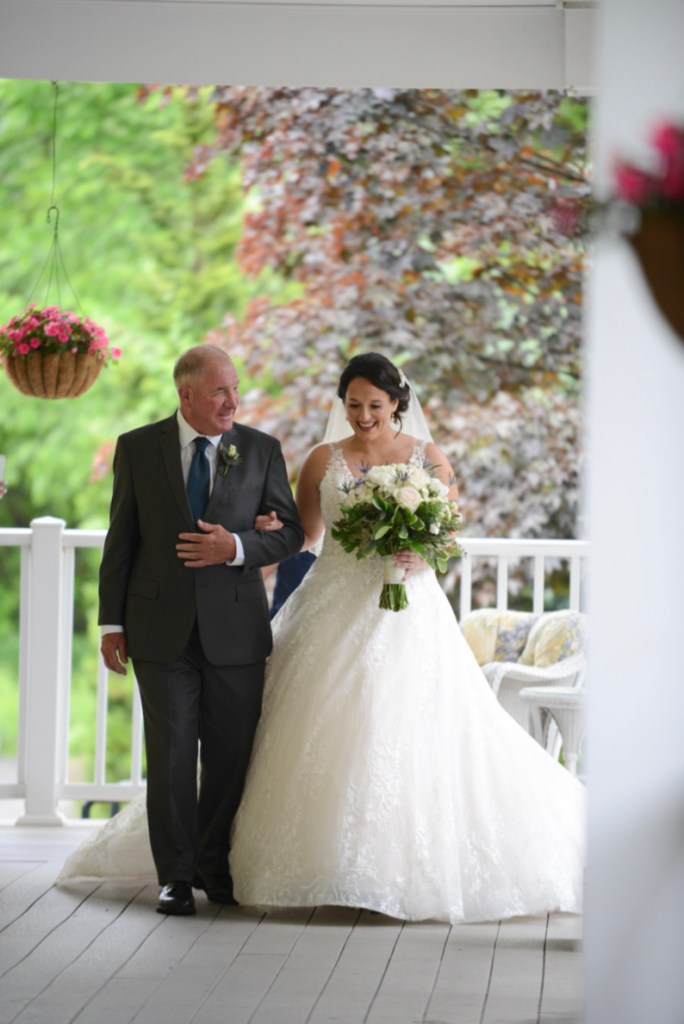 view image of the father walking the bride in a new tab